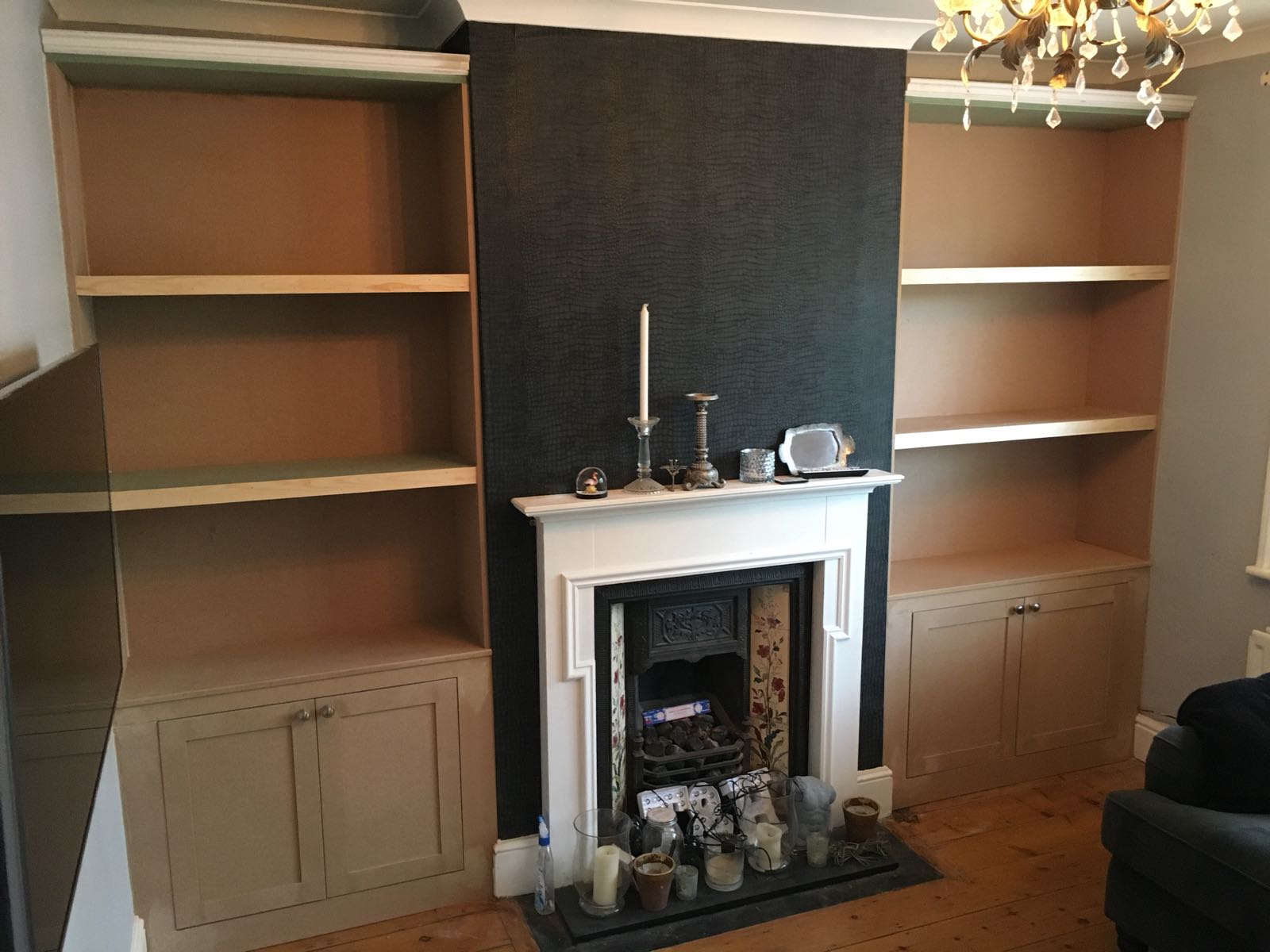 Both alcove shelving units flanking the fireplace